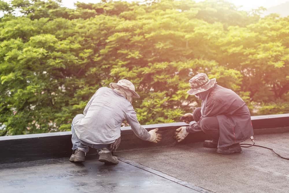 A flat roof terrace being prepared with a protective waterproof surface